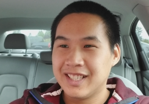 headshot of Nicholas in a car looking to the left